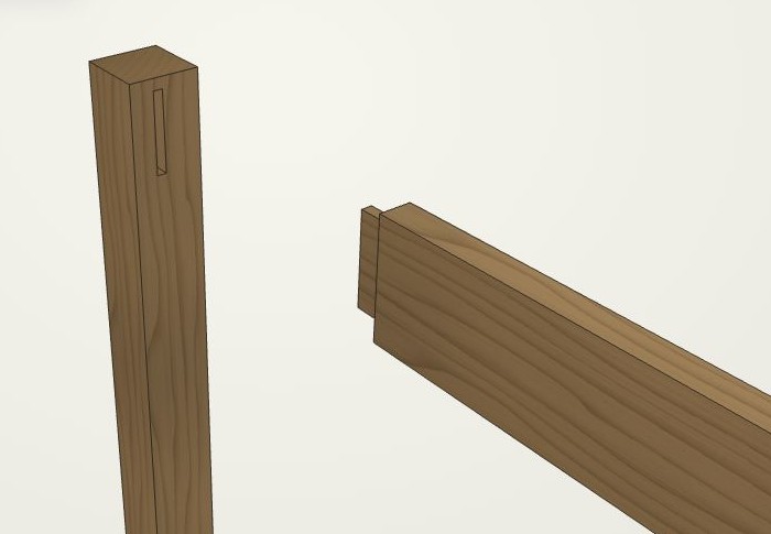 Close-up of a mortise in an oak table leg and the matching tenon on the separated rail.